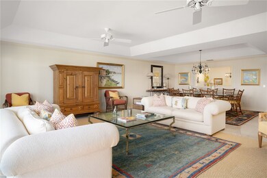 Living area featuring a tray ceiling