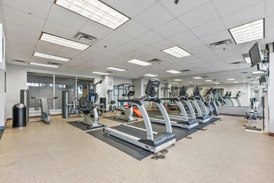 Workout area featuring a drop ceiling