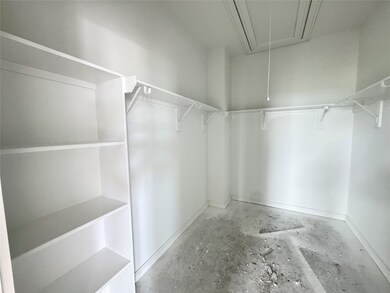 Spacious walk-in closet in the primary suite - sti