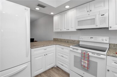 Unit B - Kitchen - granite counter tops pass throu