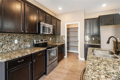 Kitchen featuring appliances with stainless steel