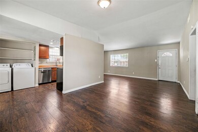 Unfurnished living room featuring hardwood / wood-