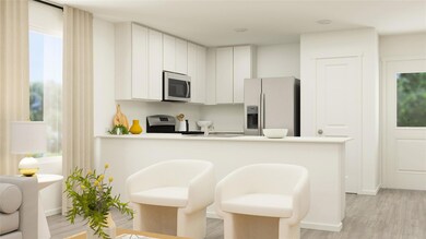 Kitchen featuring white cabinets, a kitchen breakf