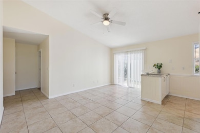 All tile flooring in the kitchen, living room and dining room with vaulted ceilings
