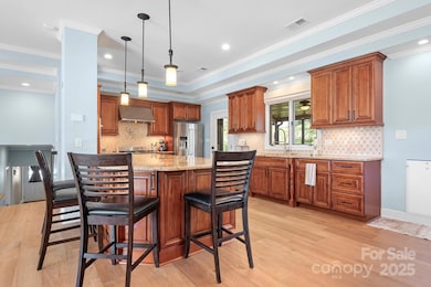 Heart of the home, this kitchen offers ample counter space, a generous island, and plenty of storage for all your culinary needs