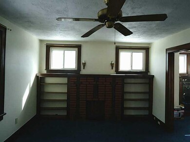 Living Room. Built-in shelves and decorative firep
