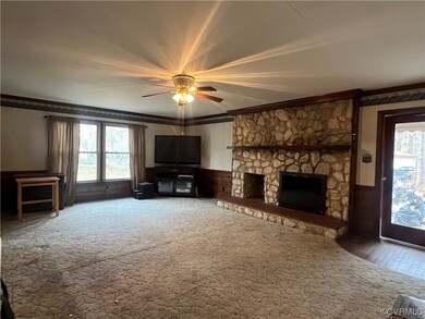 Unfurnished living room featuring dark colored car