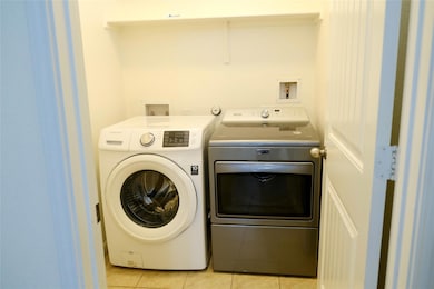 Laundry room featuring washing machine and dryer 