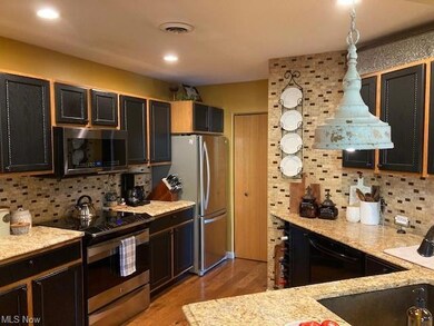 Granite countertops & tiled walls as well as back 