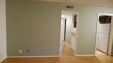 Hallway with light wood-type flooring