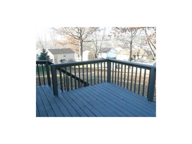 Big deck overlooks great backyard.