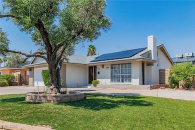 View of front of property with concrete driveway,