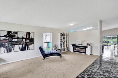 As you enter the front door the living room is to 