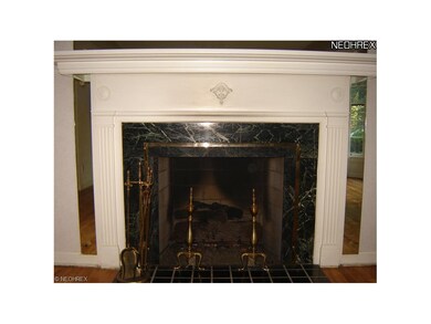 Detailed view of living room fireplace with marble