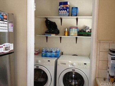 Laundry room besides kitchen