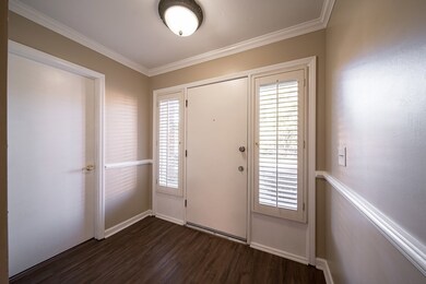 Foyer has half bath/laundry combo