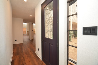A cheerful and bright entry foyer. New flooring on