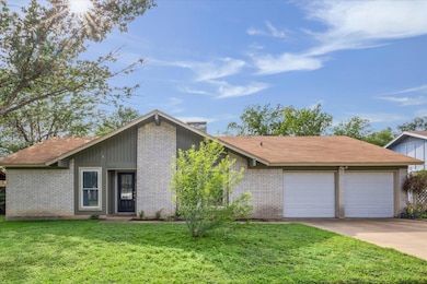 Mid-century home with an attached garage, concret