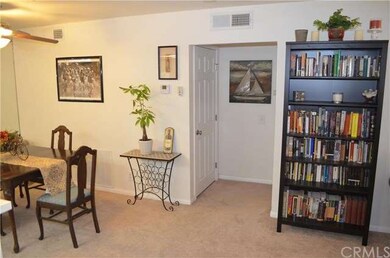 Dining area with hall to bedroom and closet door f