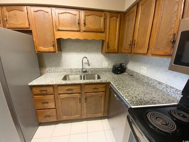 Kitchen with light tile patterned flooring, light 