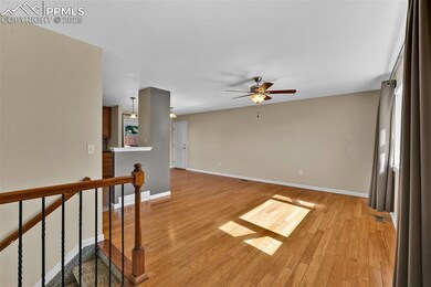 Empty room with light wood finished floors, visibl