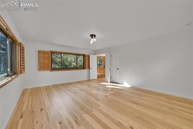 Empty room with light wood-style flooring and base