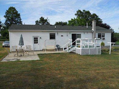 Exterior Back. Rear of the house, featuring a Deck