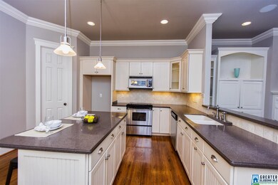 Kitchen includes an eat-in breakfast area, island,