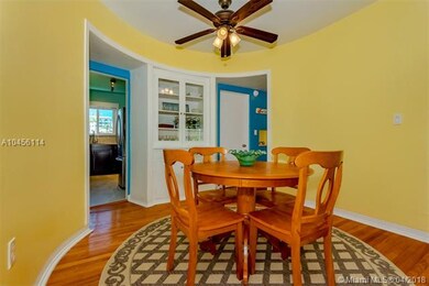 Built-in wooden cabinetry in dining area.