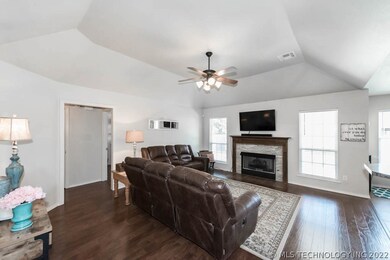 The living area, hallway and one of the guest room