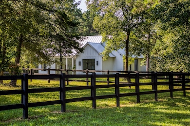Nestled at the end of a gated country lane is this