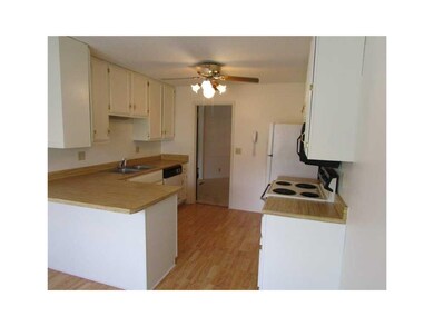 Kitchen. Kitchen has a breakfast bar, dining area,