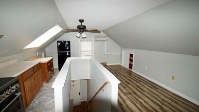 stairway into the kitchen/living room