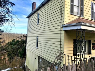 Left side of large home.