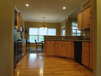 Kitchen. Hardwood floors, beautiful cabinets, solid surface counters -