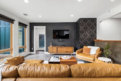 Living area featuring recessed lighting and tile 