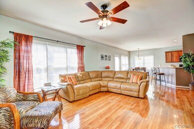 Another view of family room with three large windo