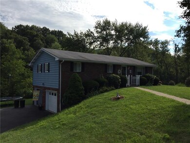 Country living with tree lined backyard