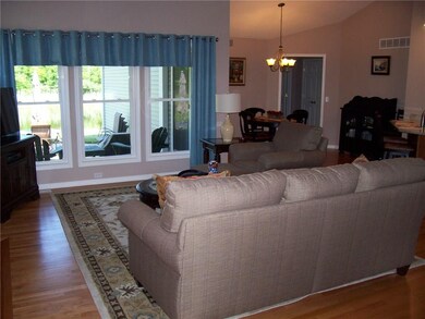 Cathedral great room from entry foyer. Hardwood fl