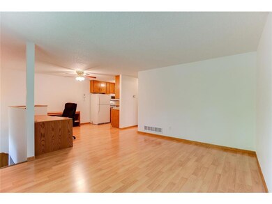 Laminate flooring in living room, dining room, and