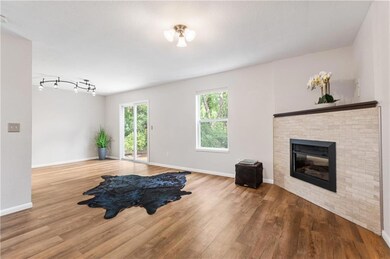 Living room featuring track lighting and hardwood / wood-style flooring