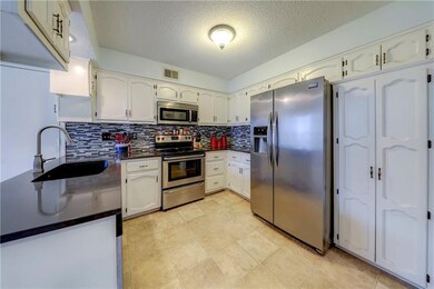 Kitchen with quartz counter tops and stainless ste