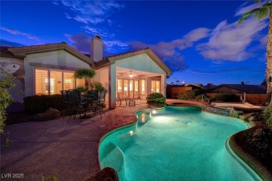 View of pool featuring a patio area, a fenced back