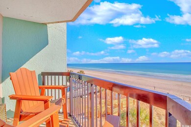 Balcony with a view of the beach and a water view