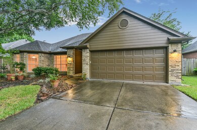This home boasts a 2-car garage, double-wide driveway, gutters, down-lighting, nice shade tree and large flower bed in the front yard