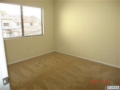 Large bedroom with mirror wardrobe doors