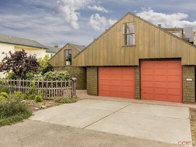 2 car garage with higher RV door on one side and d