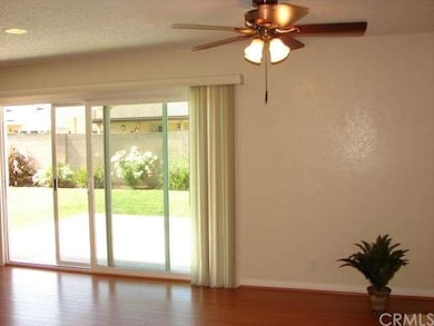 VINYL SLIDING GLASS DOORS LEADS TO LARGE BACKYARD