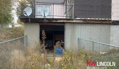 Build a garage and close this in for more basement. This is a walkout and does lead into the basement.