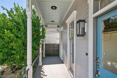 Large Porch, Gas Lamps, Wrought Iron Fence and Ban